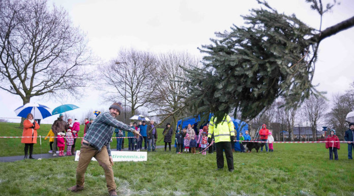 Seventh Annual Christmas Tree Throwing Championship Takes Place In Ennis